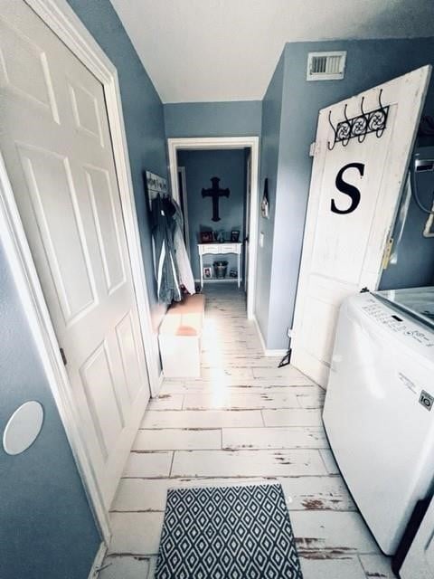 corridor featuring light wood-type flooring