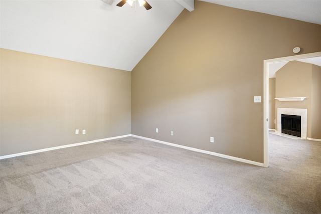 carpeted empty room featuring ceiling fan, beam ceiling, and high vaulted ceiling