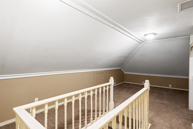 bonus room with carpet flooring and vaulted ceiling