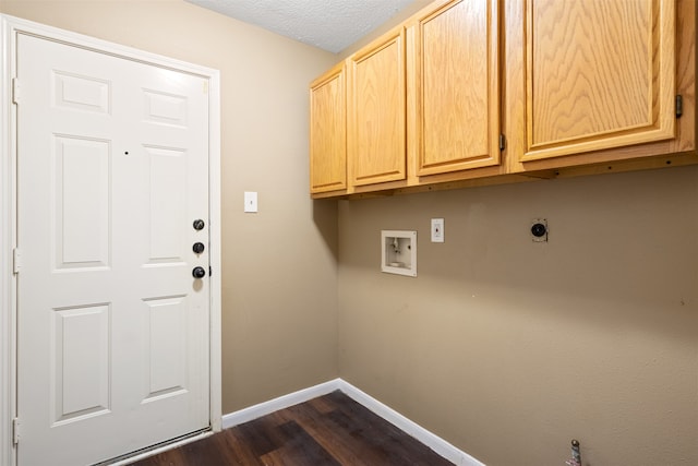 clothes washing area with cabinets, washer hookup, electric dryer hookup, dark hardwood / wood-style floors, and a textured ceiling