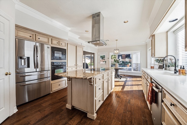 kitchen with island exhaust hood, pendant lighting, plenty of natural light, and black appliances