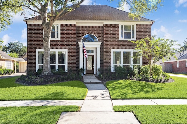 view of front of house with a front lawn