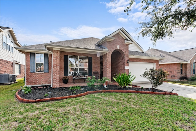 view of front of property with a front lawn, a garage, and central AC unit