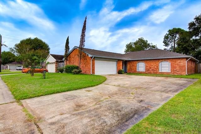 ranch-style home with a garage and a front yard