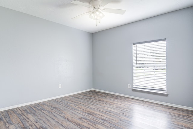 unfurnished room with wood-type flooring and ceiling fan