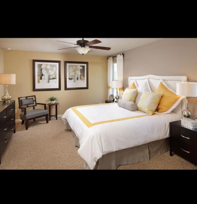 bedroom featuring ceiling fan and light carpet