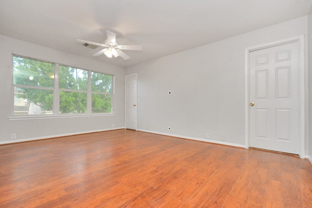 spare room featuring ceiling fan and hardwood / wood-style floors