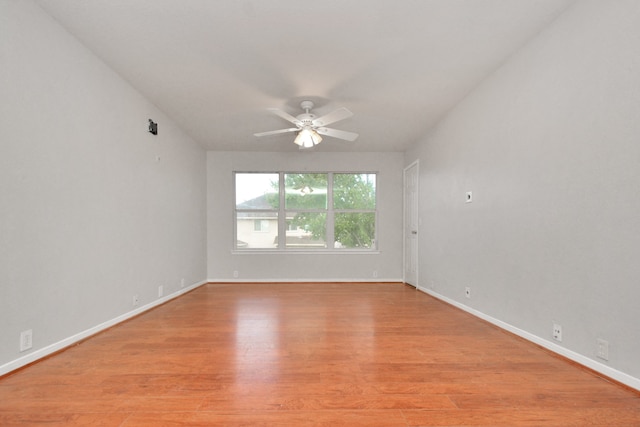 empty room with light hardwood / wood-style flooring and ceiling fan