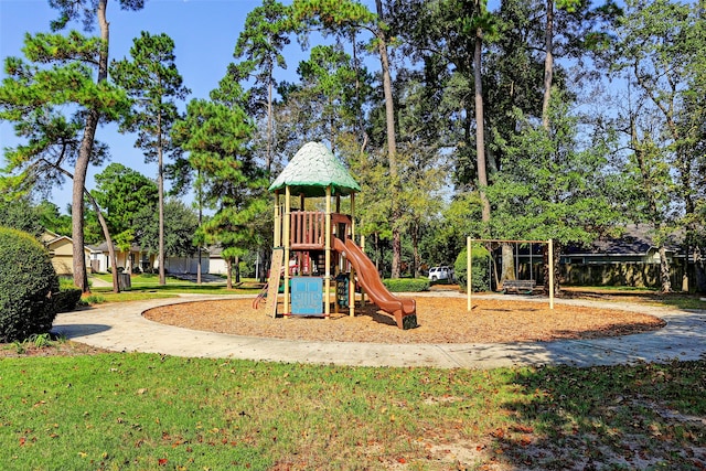 community play area featuring a lawn