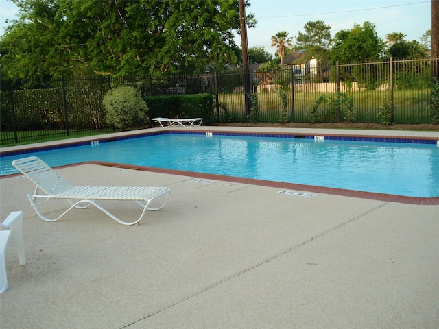 view of swimming pool featuring a patio area