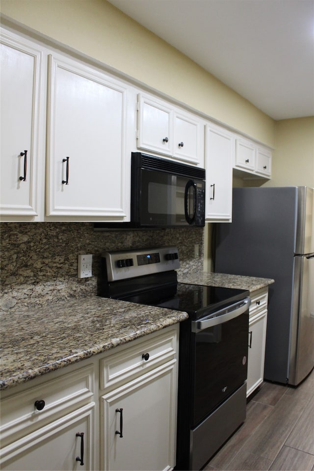 kitchen featuring white cabinets, backsplash, stainless steel appliances, and stone counters