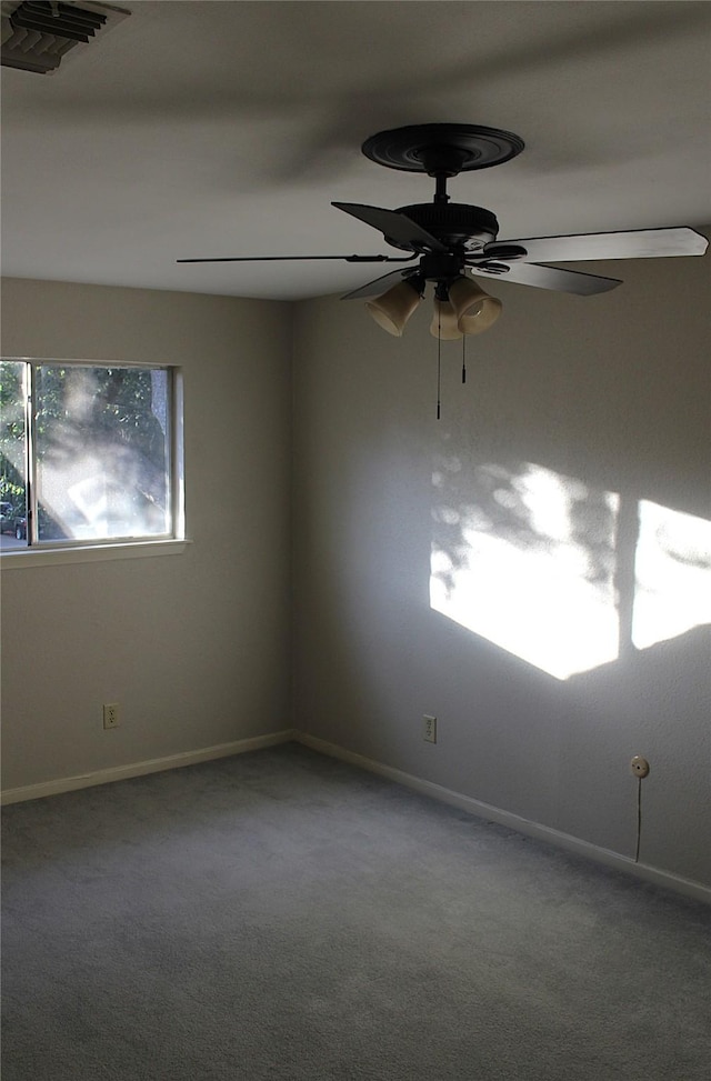 carpeted empty room with ceiling fan