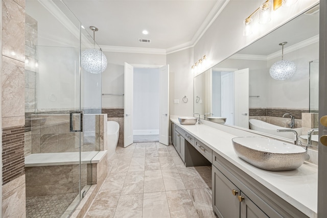 bathroom featuring ornamental molding, vanity, an inviting chandelier, tile walls, and independent shower and bath