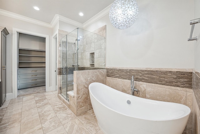 bathroom featuring built in features, ornamental molding, and independent shower and bath