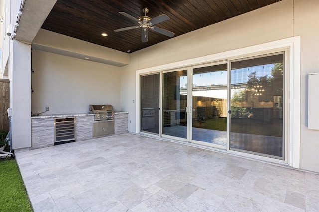 view of patio / terrace featuring ceiling fan, area for grilling, grilling area, and beverage cooler