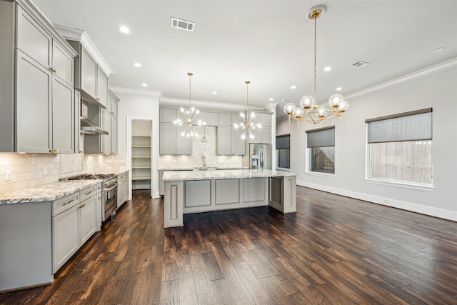 kitchen featuring gray cabinetry, dark hardwood / wood-style flooring, and stainless steel appliances