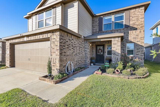 view of front of house featuring a front yard and a garage