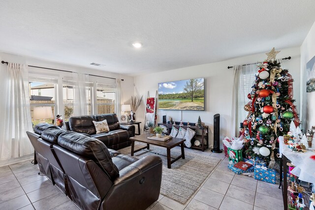 tiled living room with a textured ceiling