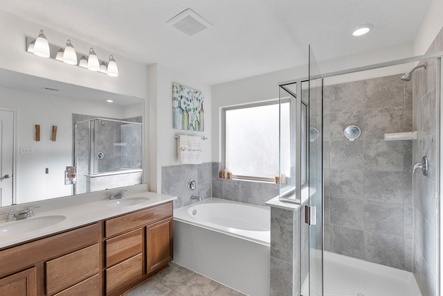 bathroom featuring vanity and plus walk in shower