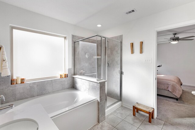 bathroom featuring separate shower and tub, tile patterned floors, ceiling fan, and sink