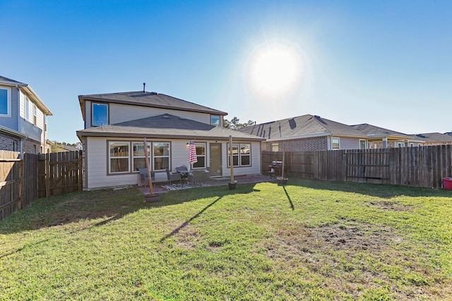 rear view of house with a lawn