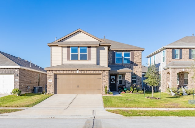 view of front facade with a garage and a front yard