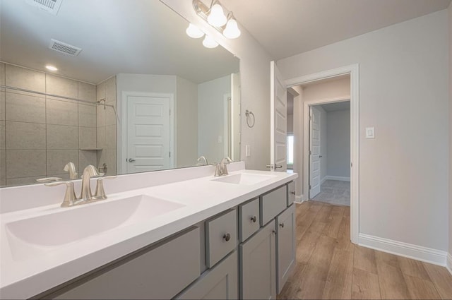 bathroom featuring hardwood / wood-style floors and vanity