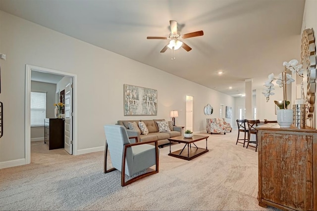 carpeted living room featuring ceiling fan and plenty of natural light