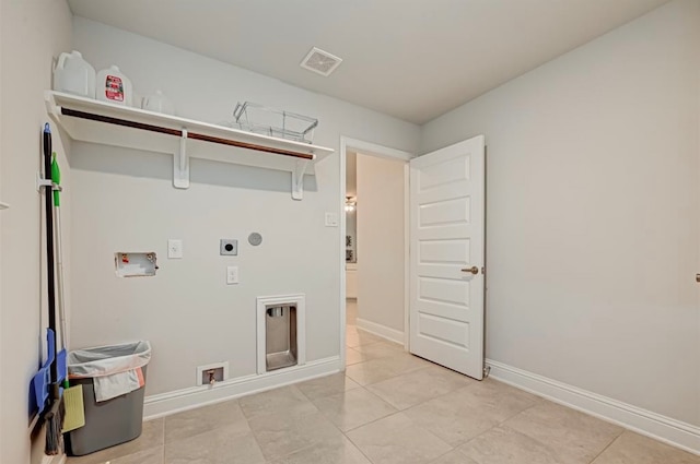 clothes washing area featuring electric dryer hookup, light tile patterned floors, and washer hookup