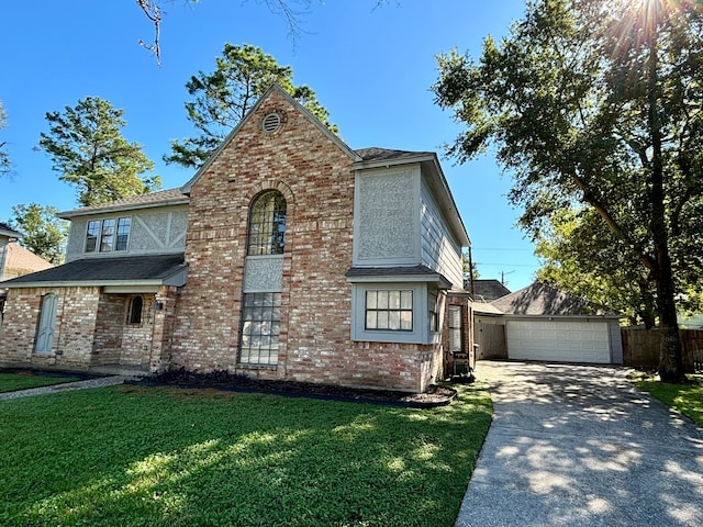 view of front of house featuring a front yard and a garage