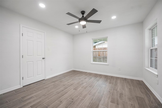 spare room featuring ceiling fan and light wood-type flooring