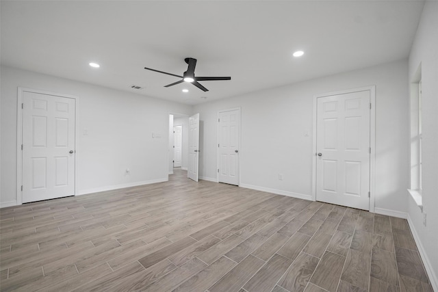 unfurnished bedroom featuring ceiling fan and light hardwood / wood-style floors