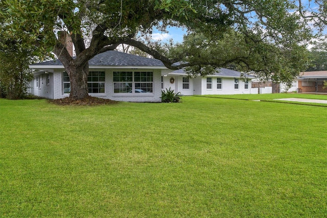 view of front of home with a front lawn