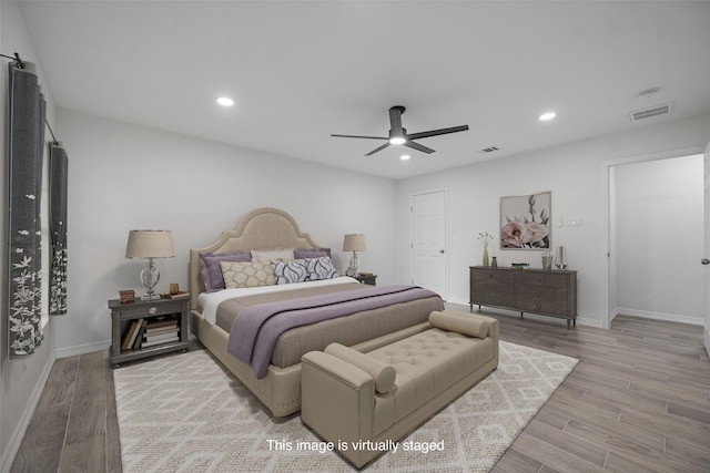 bedroom featuring ceiling fan and light hardwood / wood-style floors