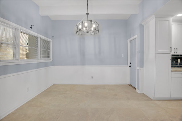 unfurnished dining area featuring beamed ceiling, light tile patterned floors, and a notable chandelier