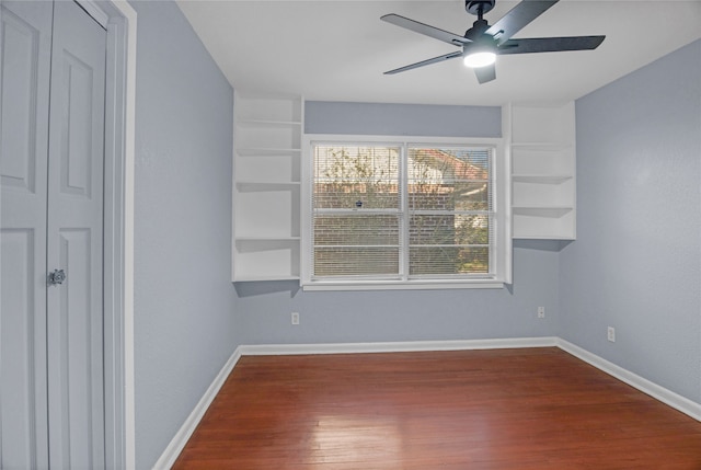 spare room with ceiling fan and wood-type flooring