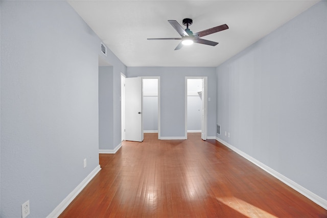 interior space with wood-type flooring and ceiling fan