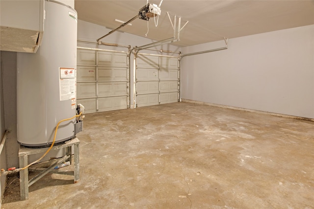 garage with a garage door opener and water heater