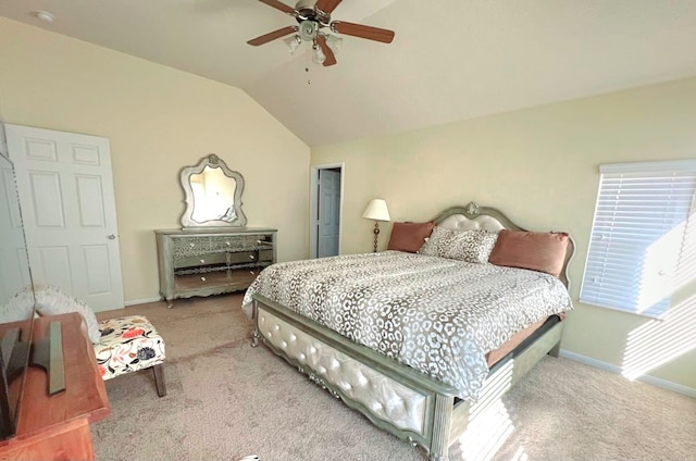 bedroom with ceiling fan, light colored carpet, and lofted ceiling