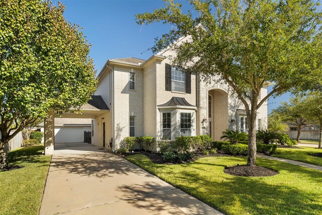 view of front of house featuring a front yard and a garage