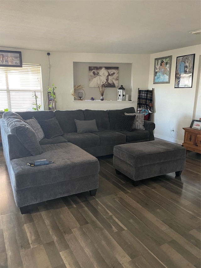 living room with dark hardwood / wood-style flooring