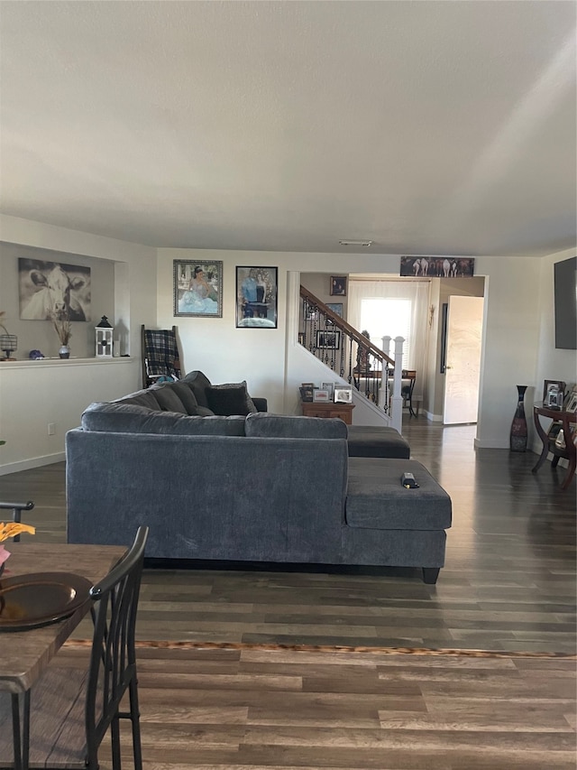 living room featuring dark wood-type flooring