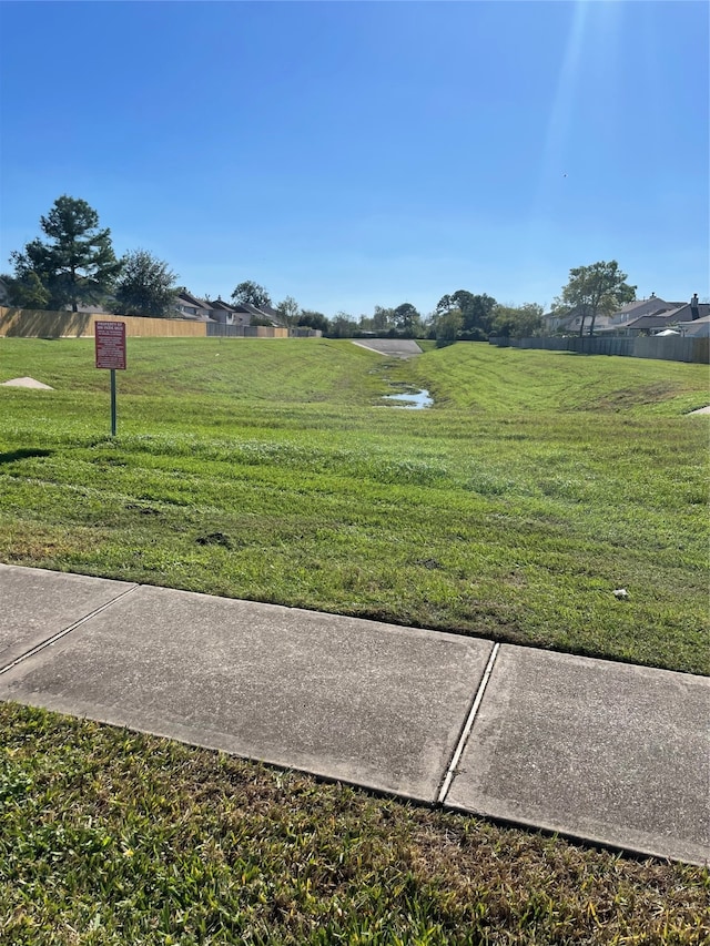 surrounding community featuring a lawn