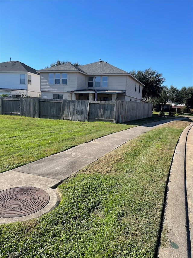 view of home's exterior with a lawn