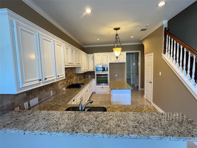 kitchen with sink, light tile patterned floors, white cabinetry, backsplash, and stainless steel appliances