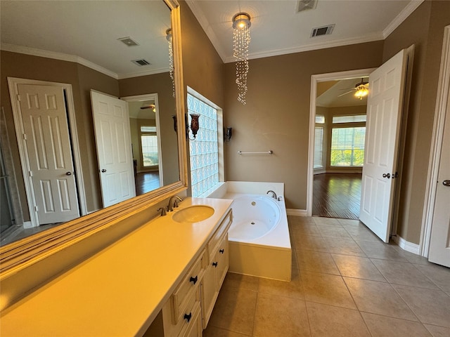 bathroom featuring crown molding, ceiling fan, vanity, tile patterned floors, and a tub