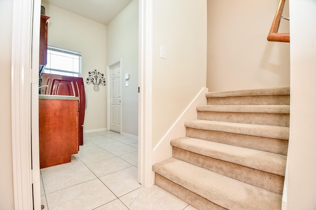 stairway featuring tile patterned floors