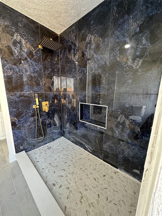 bathroom with tile patterned floors, a shower, and tile walls