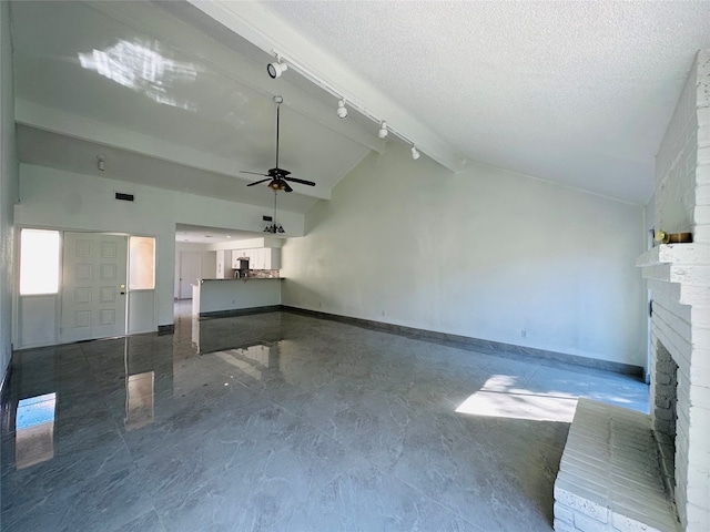 unfurnished living room featuring high vaulted ceiling, a brick fireplace, ceiling fan, a textured ceiling, and beamed ceiling