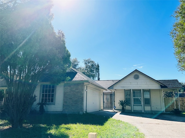 view of front of home featuring covered porch and a garage